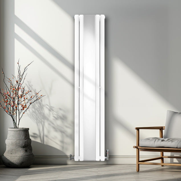 Radiador de columna ovalada blanco de 1800 mm x 380 mm, con espejo y válvulas, instalado en una pared moderna junto a una planta decorativa
