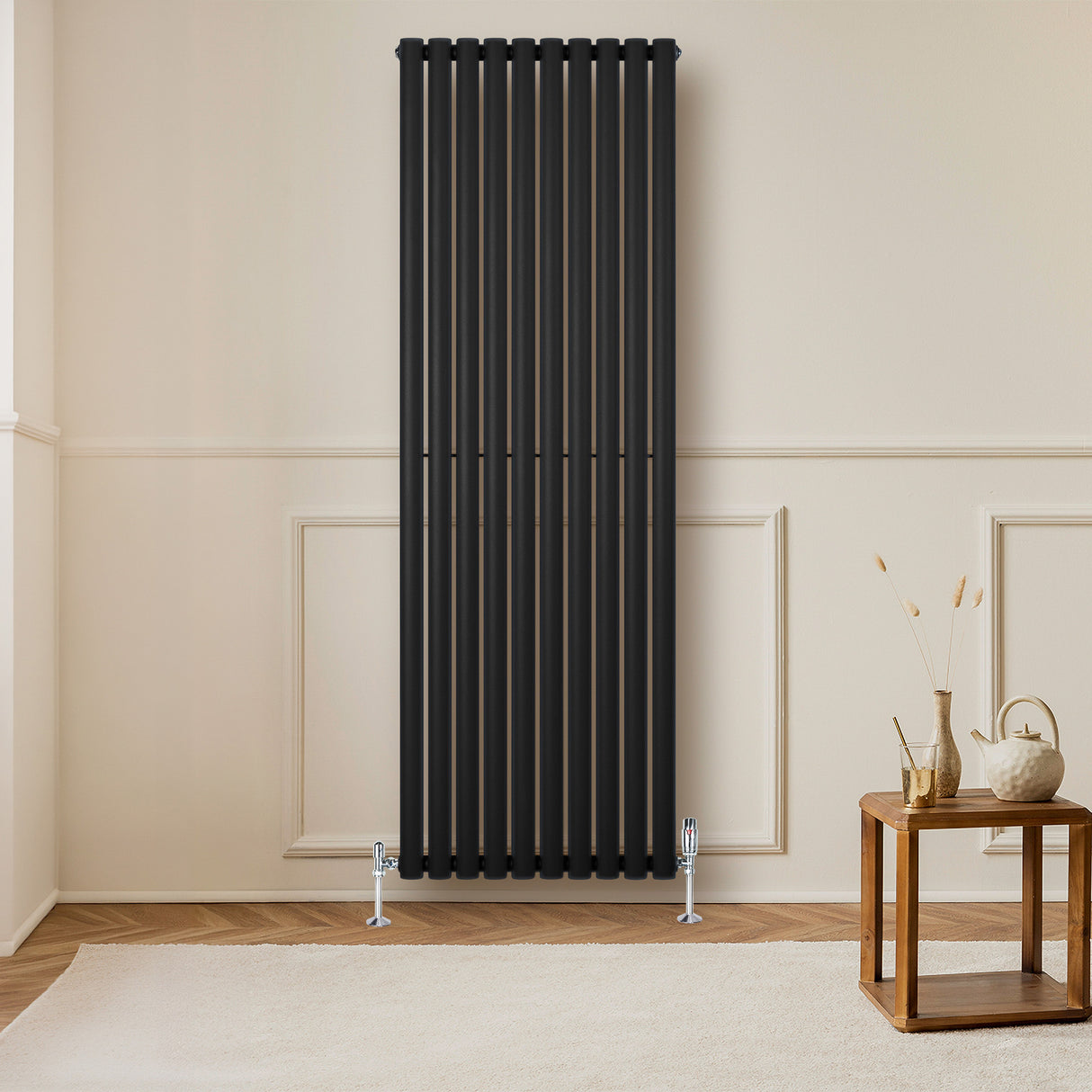 Radiador de columna ovalado negro de 1800 mm x 600 mm con válvulas, elegante diseño vertical y acabado mate en un ambiente moderno