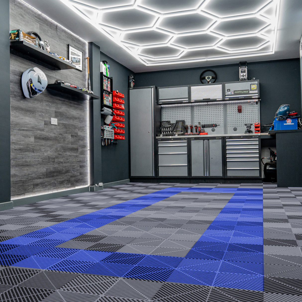 Baldosas de polipropileno en tonos gris y azul, con textura de canales de ventilación, ideales para espacios de trabajo y garajes