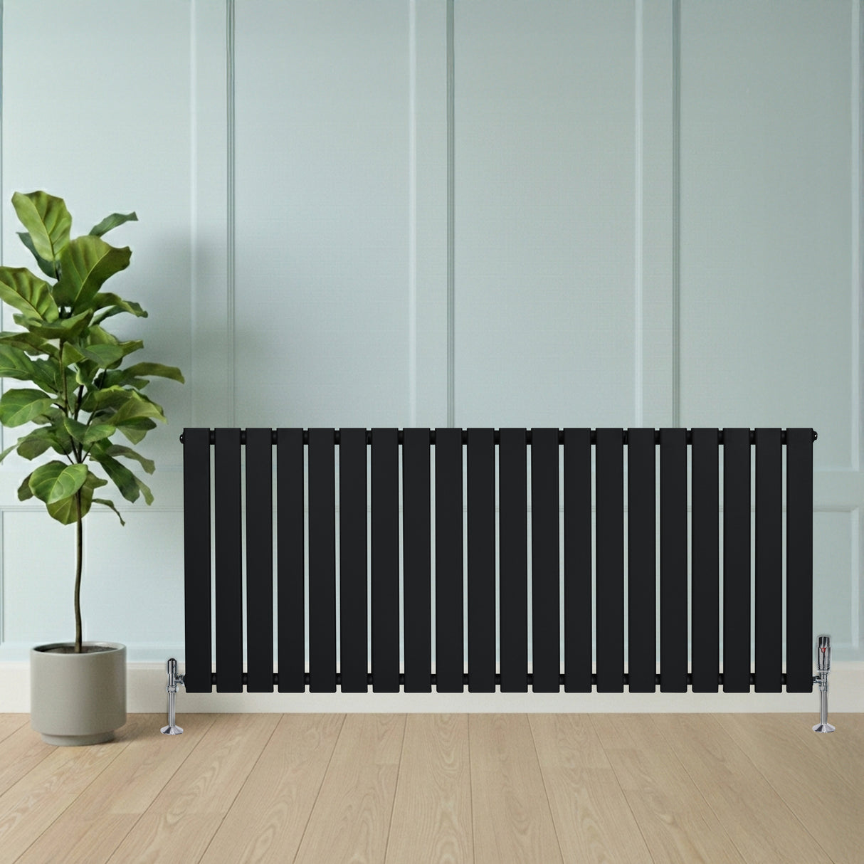Radiador de columna única negro de 600 mm x 1400 mm, con diseño elegante y moderno, ubicado junto a una planta en maceta en un ambiente luminoso