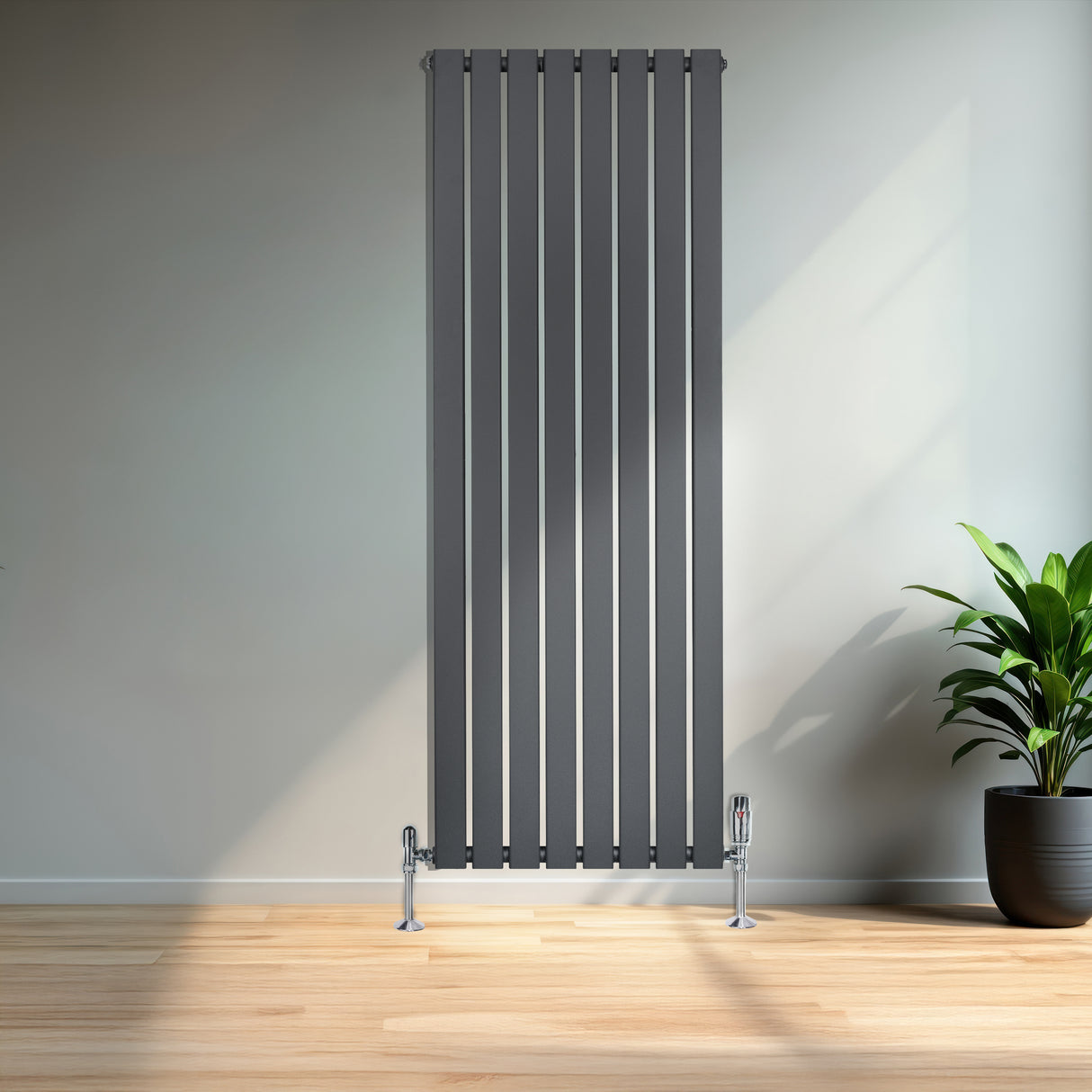 Radiador de columna única gris antracita de 1600 mm x 560 mm, con diseño vertical y acabado liso, en un ambiente moderno y luminoso