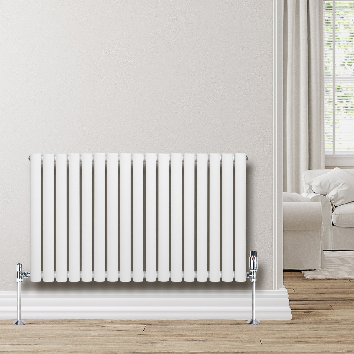 Radiador de columna ovalado blanco de 600 mm x 1020 mm, con acabado liso y grifos metálicos, instalado en una pared clara