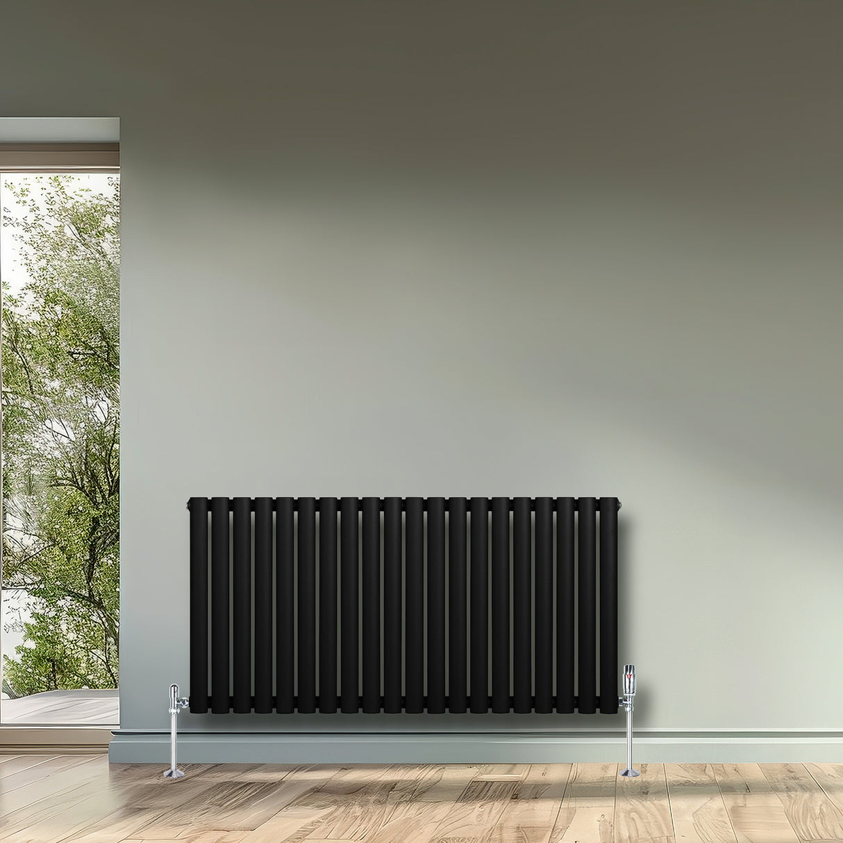 Radiador de columna ovalado negro de 600 mm x 1200 mm, con acabado liso y elegante, instalado en una pared clara y moderna