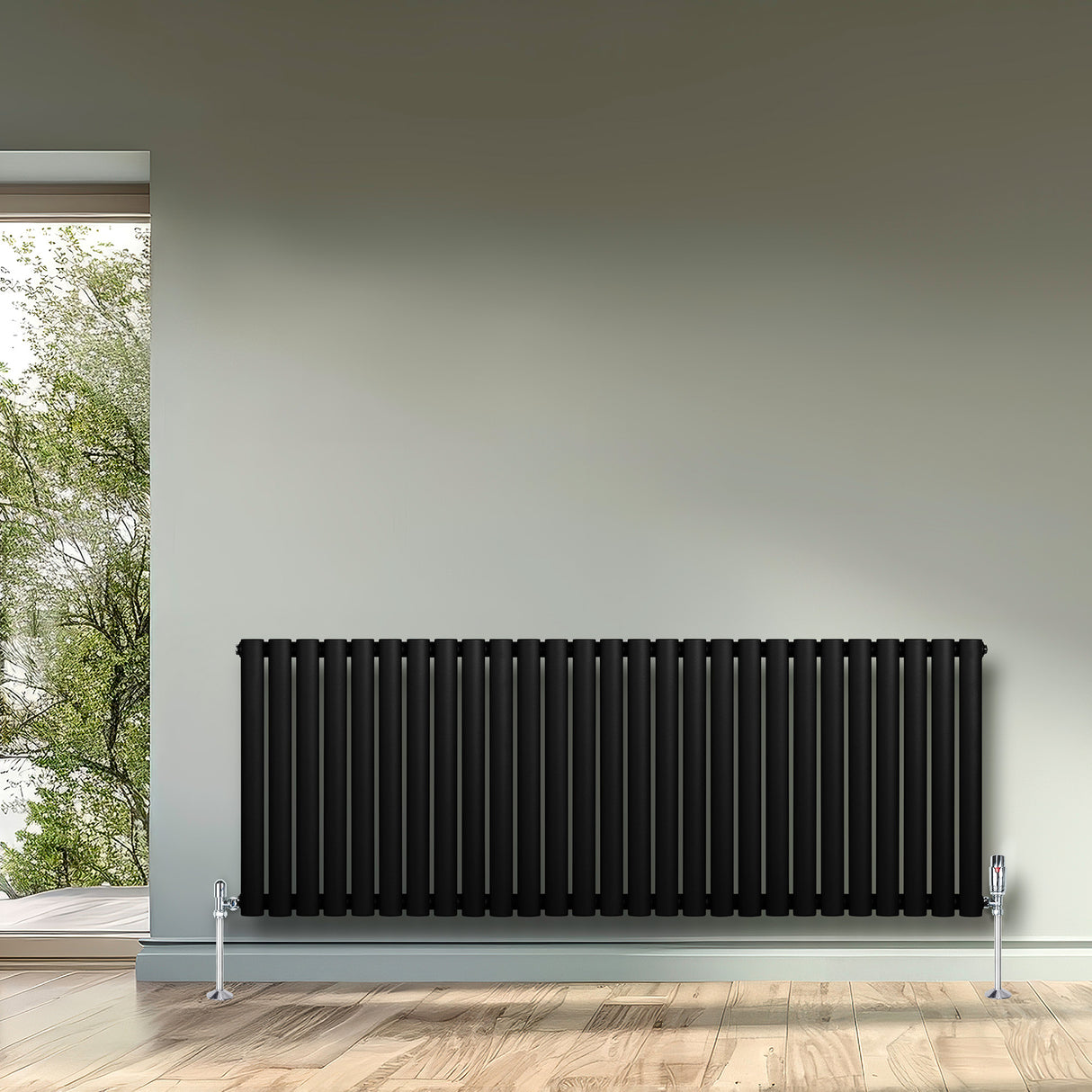 Radiador de columna ovalado negro de 600 mm x 1620 mm, con diseño elegante y acabado liso, instalado en una pared interior moderna