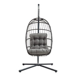 Silla colgante tipo huevo de ratán negro con cojín gris, diseño moderno y estructura metálica, ideal para interiores y exteriores