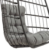 Silla colgante tipo huevo de ratán negra con cojín gris suave, diseño moderno y estructura de metal resistente, ideal para interiores y exteriores
