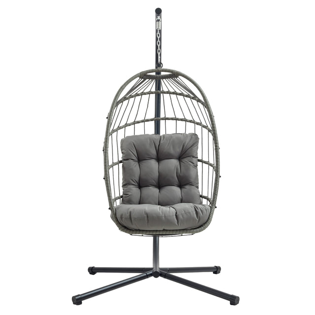Silla colgante tipo huevo de ratán gris con cojín acolchado, estructura metálica negra y diseño moderno y elegante