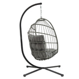 Silla colgante tipo huevo de ratán gris con cojín suave, estructura metálica negra y diseño moderno para interiores y exteriores