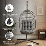 Silla colgante tipo huevo de ratán gris con cojín cómodo, estructura robusta y diseño elegante, ideal para interiores y exteriores