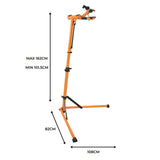 Soporte de reparación para bicicletas en color naranja, ajustable de 101.5 cm a 162 cm, con base estable y brazos acolchados para sujeción segura