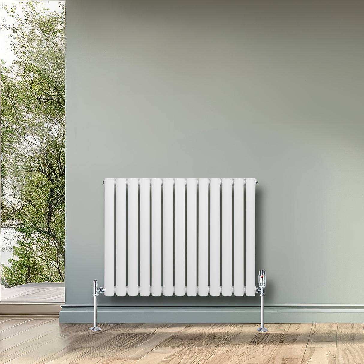 Radiador de columna ovalado blanco de 600 mm x 780 mm con válvulas, instalado en una pared verde, sobre un suelo de madera clara