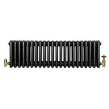 Radiador tradicional negro de 4 columnas con válvulas, acabado liso y brillante, ideal para calefacción en espacios elegantes
