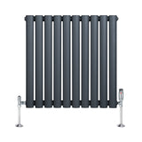 Radiador de columna ovalado en gris antracita, con diseño moderno y válvulas cromadas, ideal para calefacción eficiente