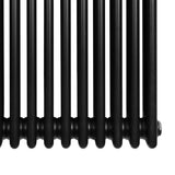 Radiador tradicional de 4 columnas en color negro, con acabado liso y brillante, ideal para calefacción en espacios modernos