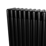 Radiador tradicional de 4 columnas en color negro, con un acabado liso y brillante, ideal para calefacción en espacios modernos