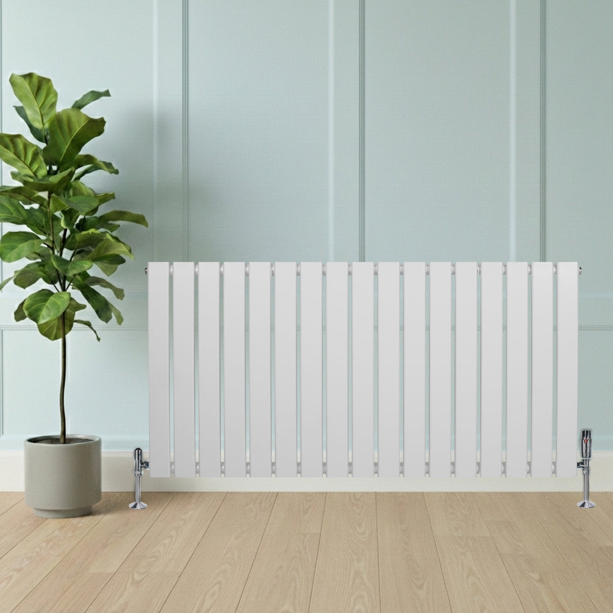 Radiador de columna única blanco de 600 mm x 1190 mm, con diseño moderno y acabado liso, colocado frente a una planta en maceta