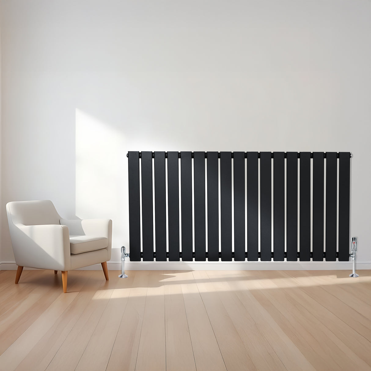 Radiador de columna única negro de 600 mm x 1190 mm, con diseño elegante y acabado liso, colocado junto a una silla moderna en un ambiente luminoso