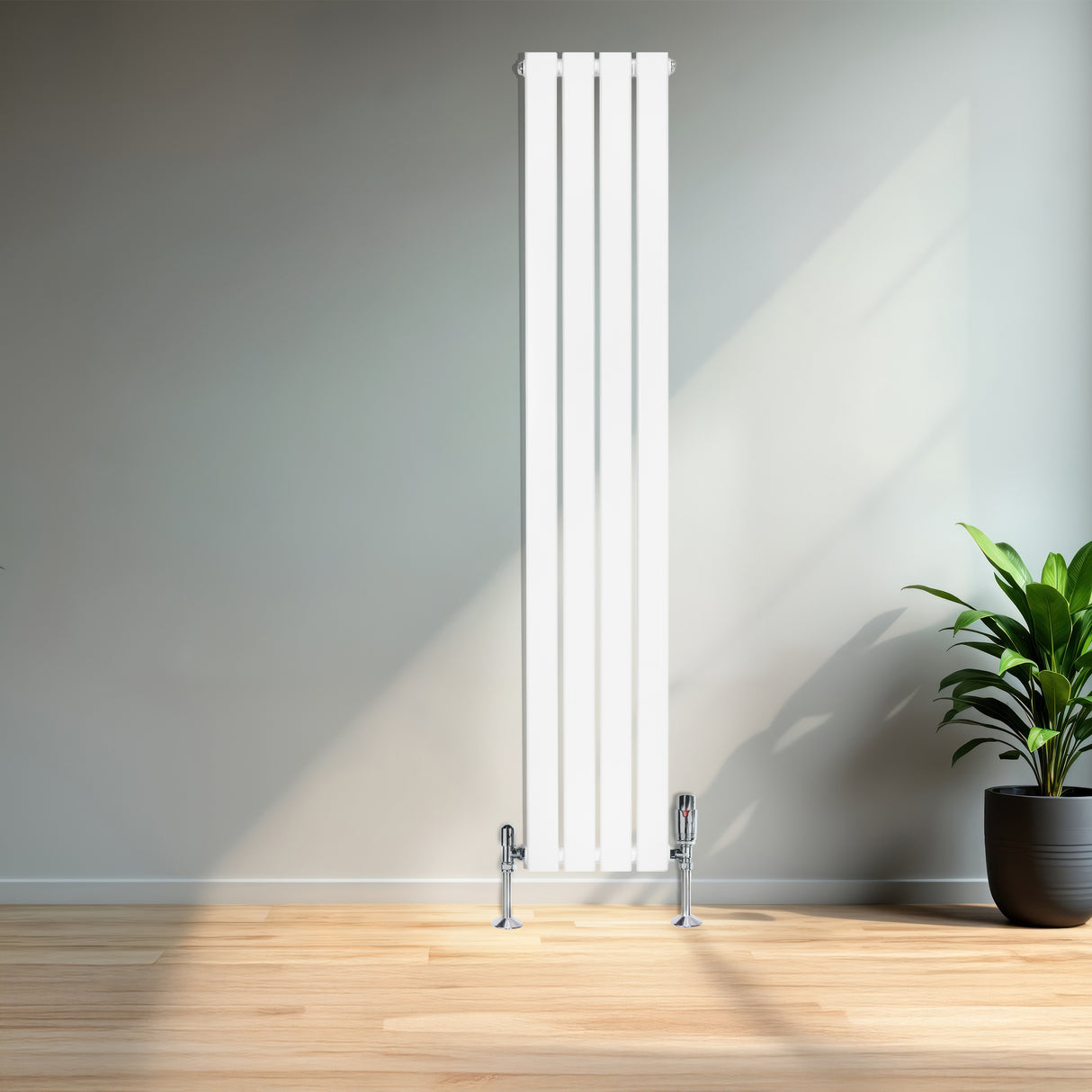 Radiador de columna blanca de 1600 mm x 280 mm, con un diseño moderno y elegante, instalado en una pared junto a una planta decorativa