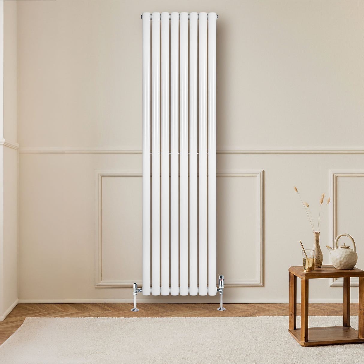 Radiador de columna ovalado blanco de 1800 mm x 480 mm, con un diseño elegante y moderno, instalado en una pared clara