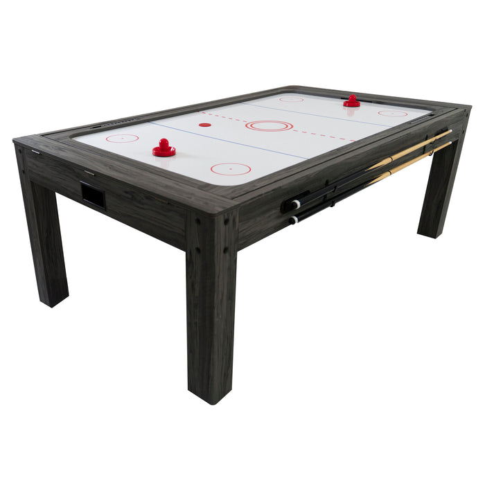 Mesa de hockey de aire con superficie blanca, bordes oscuros y dos palas de madera, ideal para entretenimiento en casa